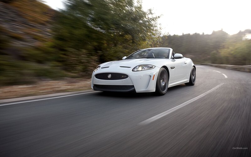 White Jaguar F-Type on a winding road