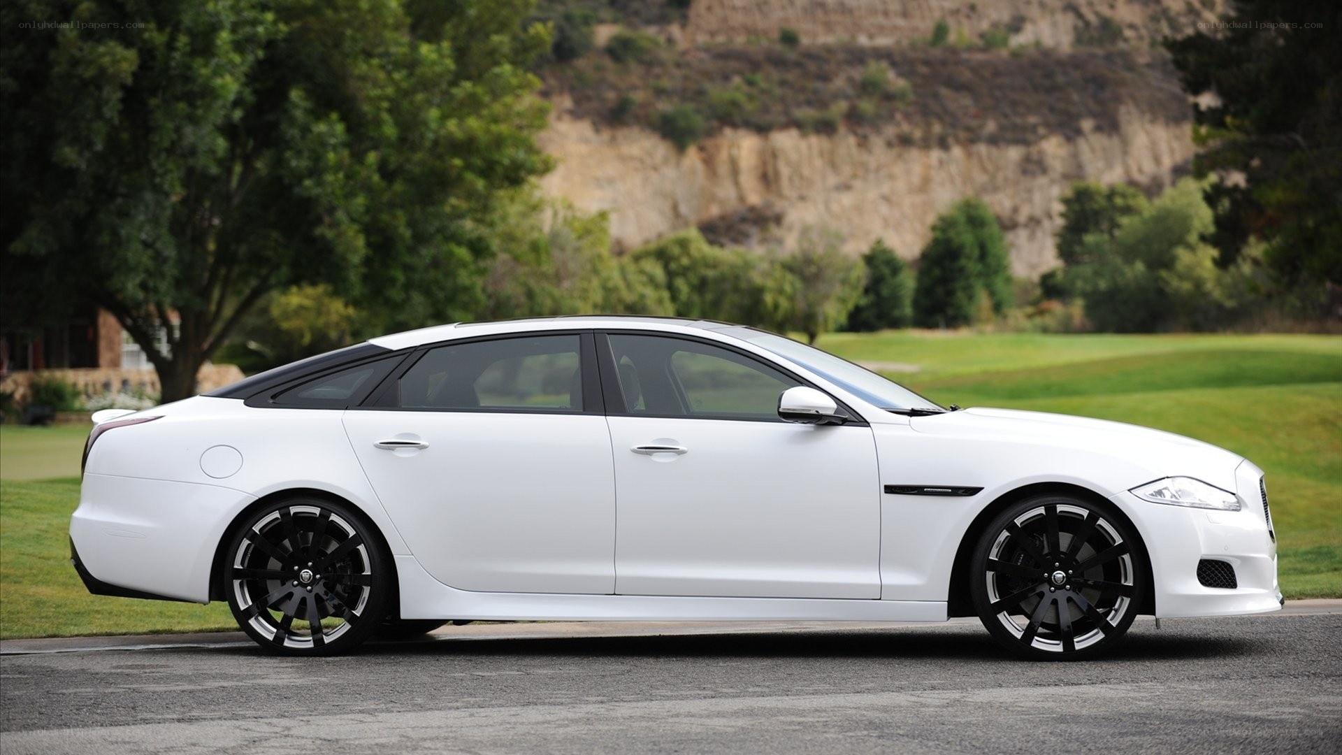 white jaguar luxury sedan