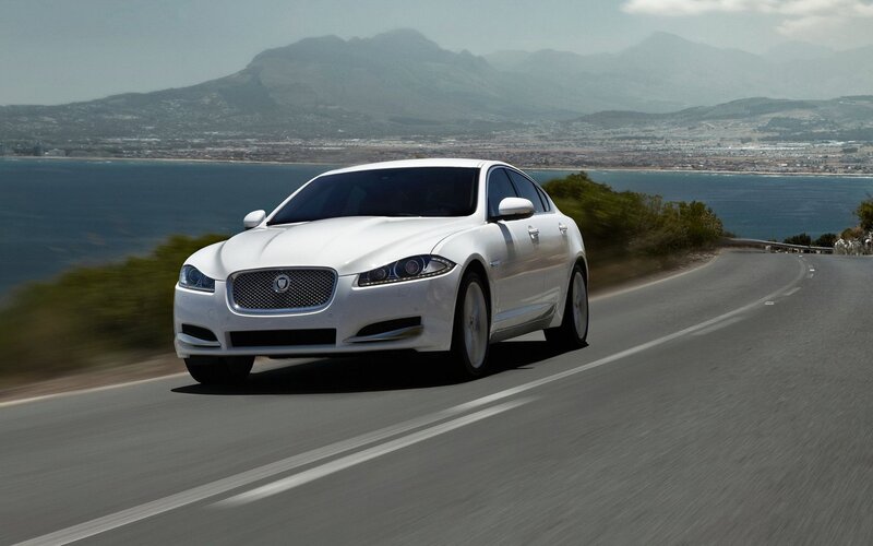White Jaguar on coastal road