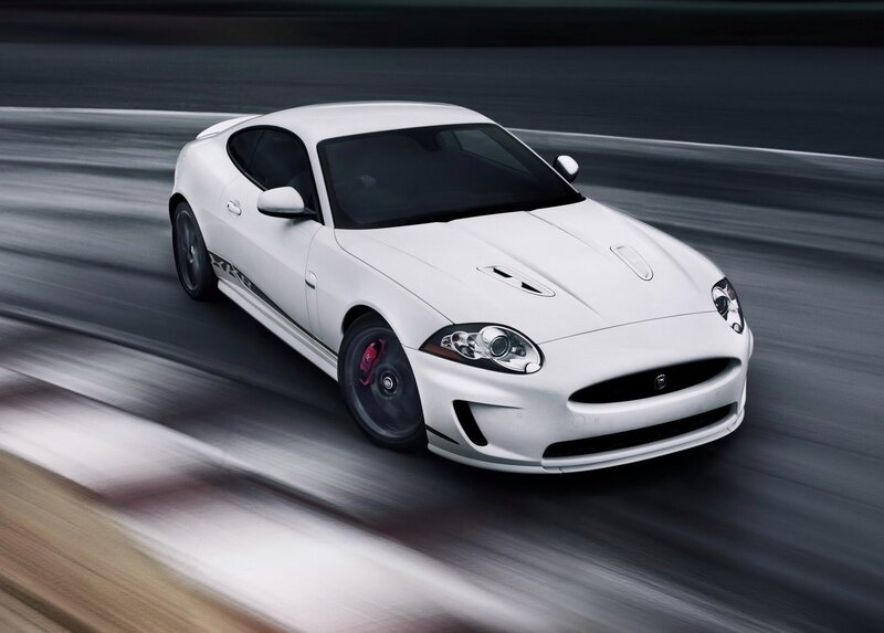 White Jaguar sports car in motion