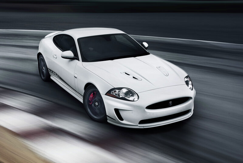 White Jaguar sports car in motion