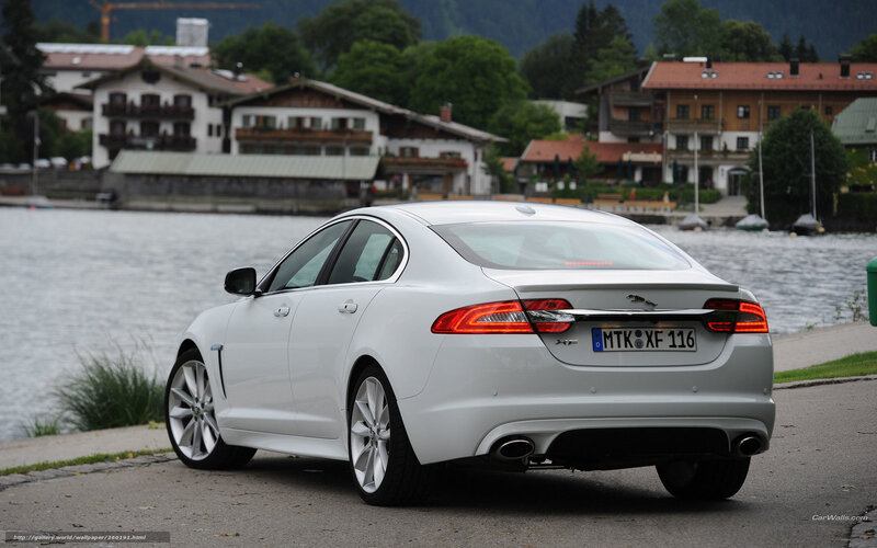 White Jaguar XF by a lake