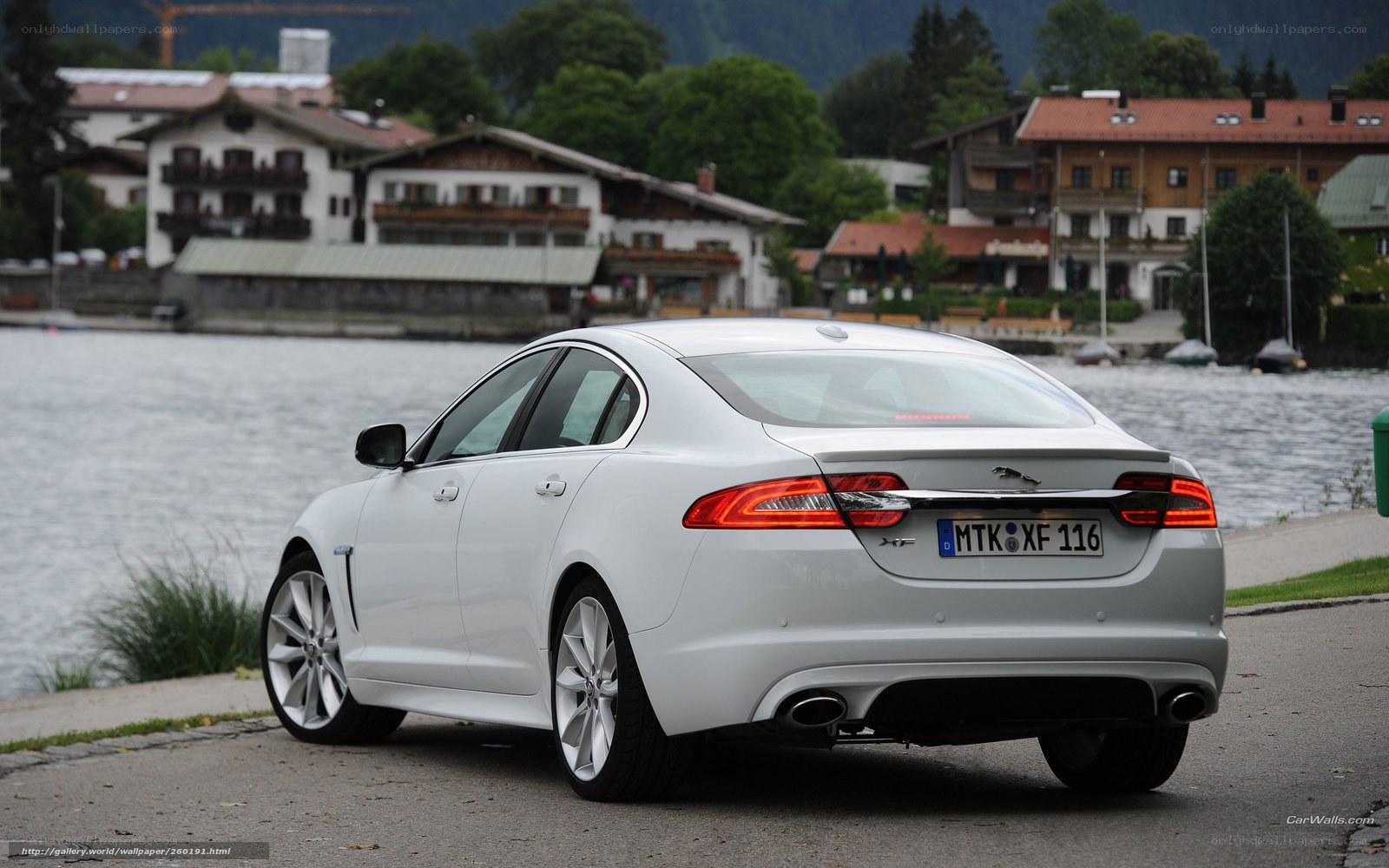 White Jaguar XF by a lake