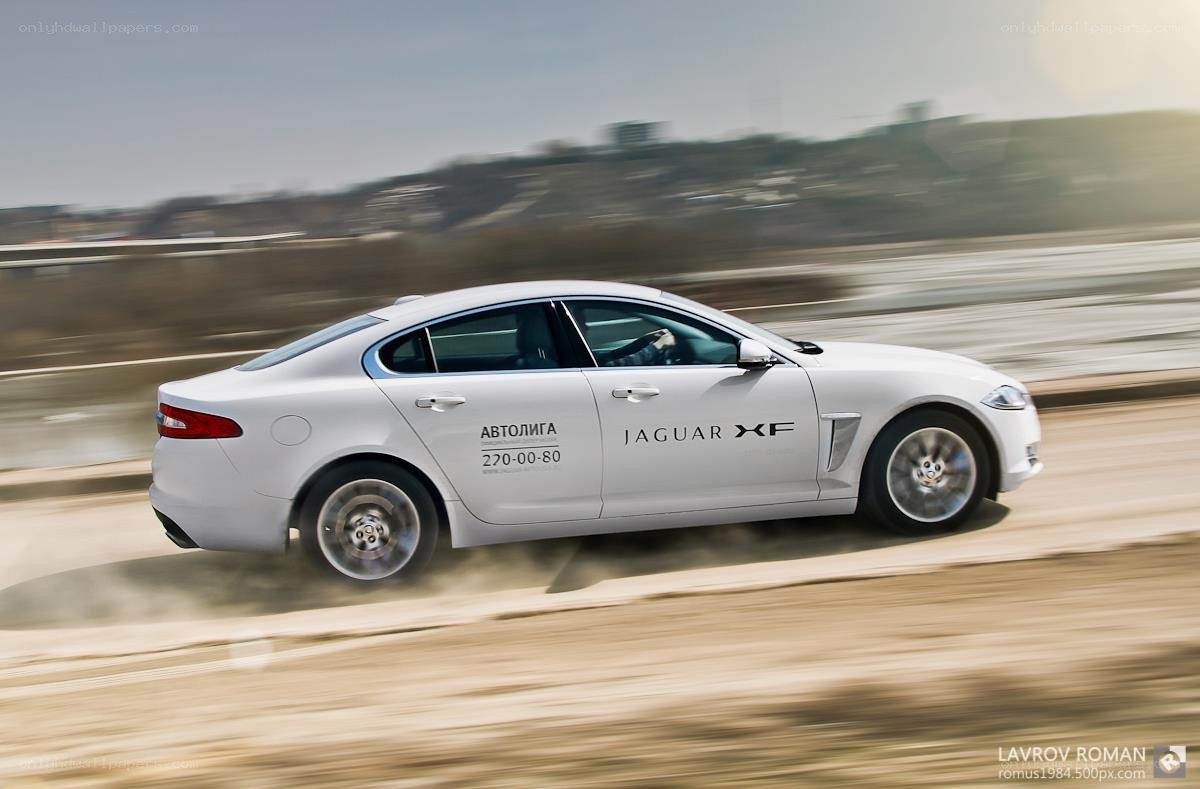 White Jaguar XF in motion
