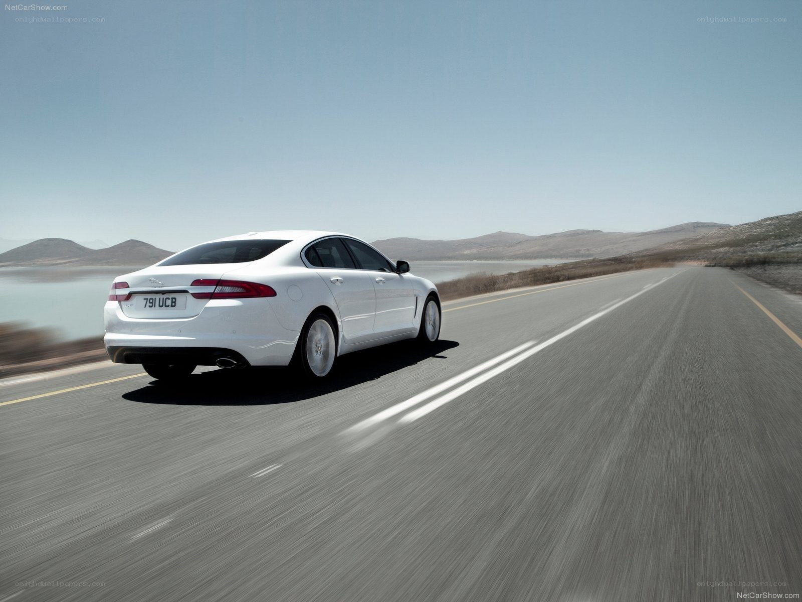 White Jaguar XF in motion