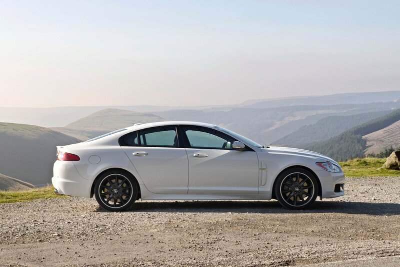 White Jaguar XF on a hillside