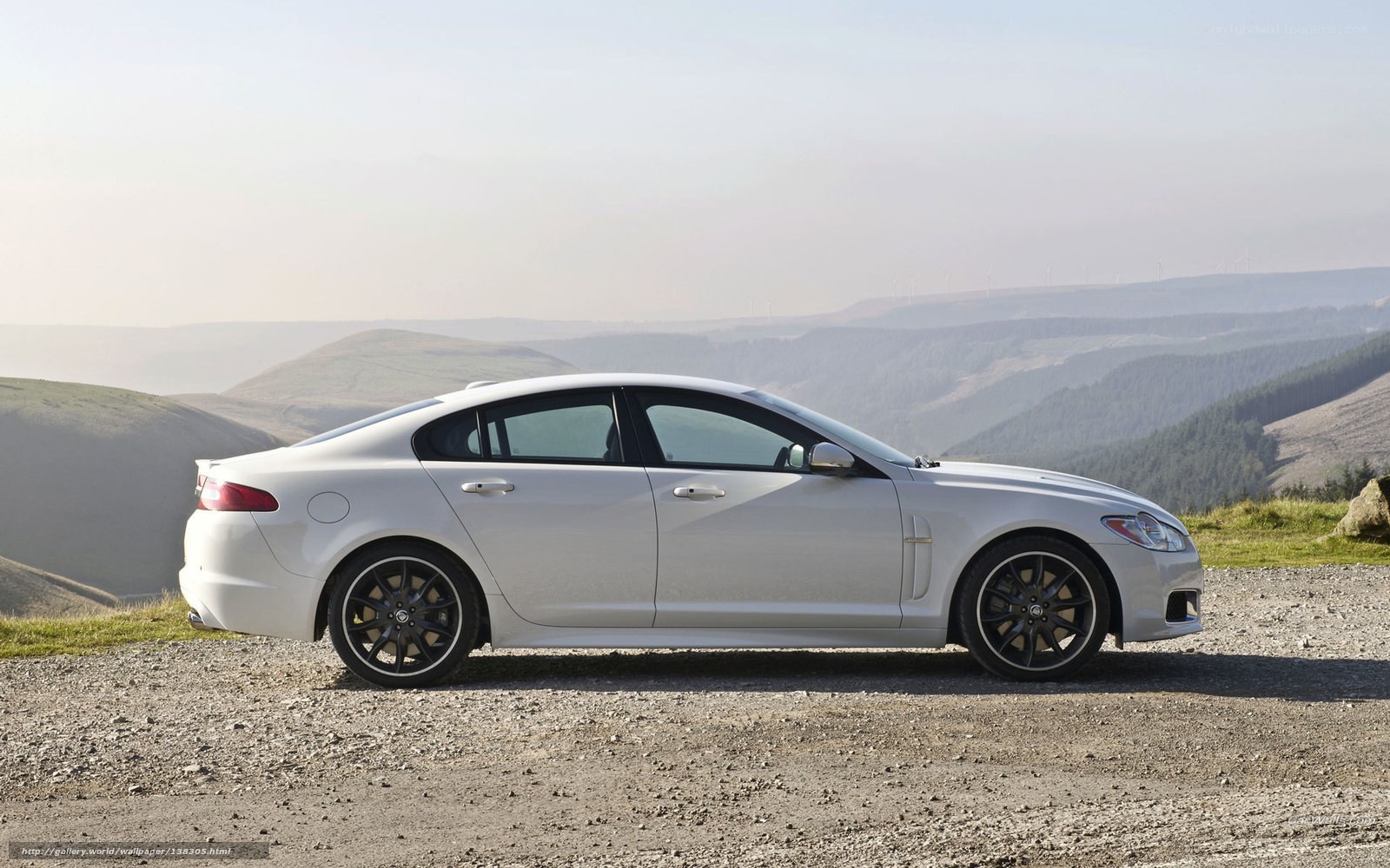 White Jaguar XF on a hillside