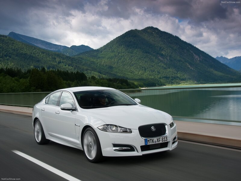 White Jaguar XF on a scenic road