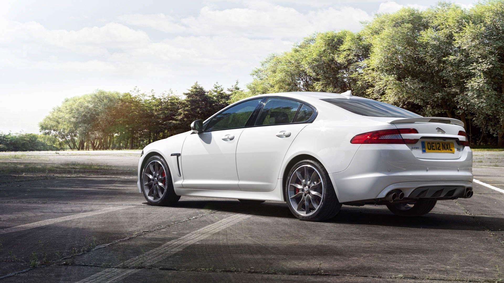 White Jaguar XF parked outside