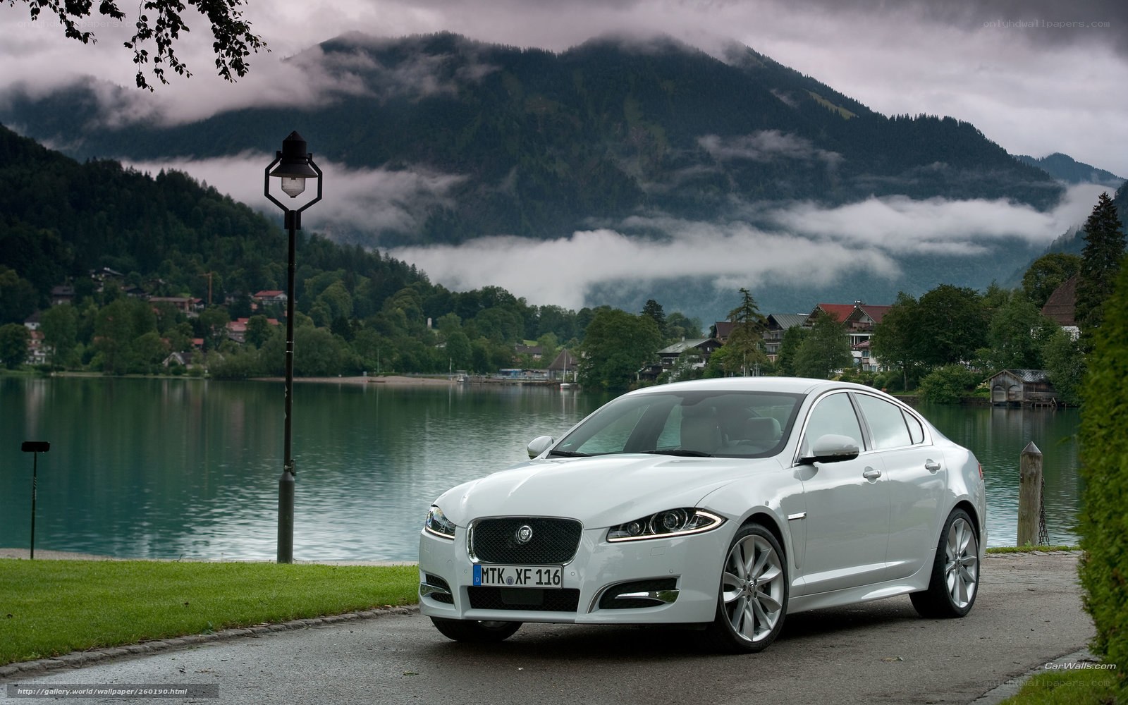 White Jaguar XFL by a lake