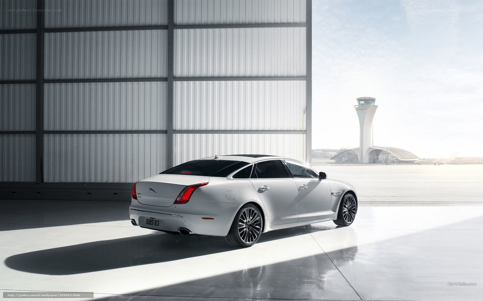 White Jaguar XJ at airport