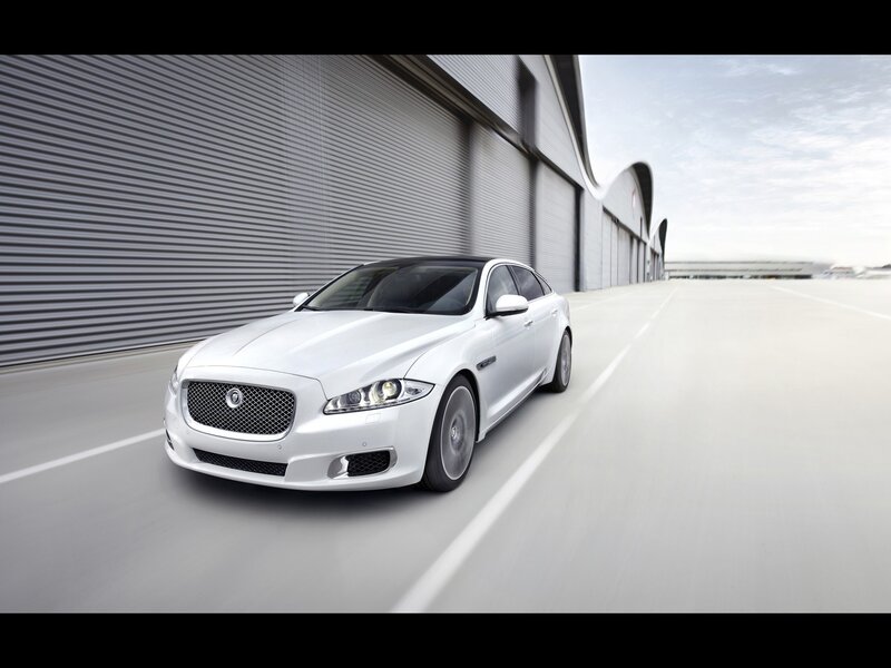 White Jaguar XJ in motion