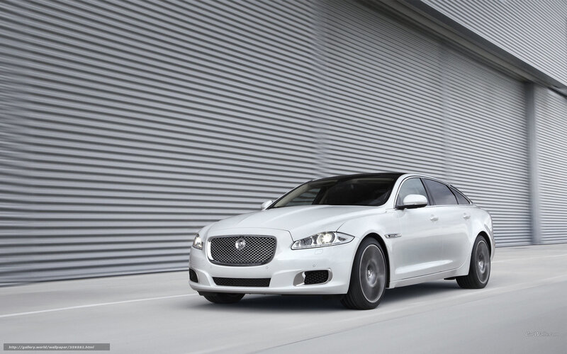 White Jaguar XJ in motion