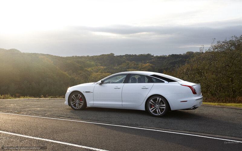 white jaguar xj on a road