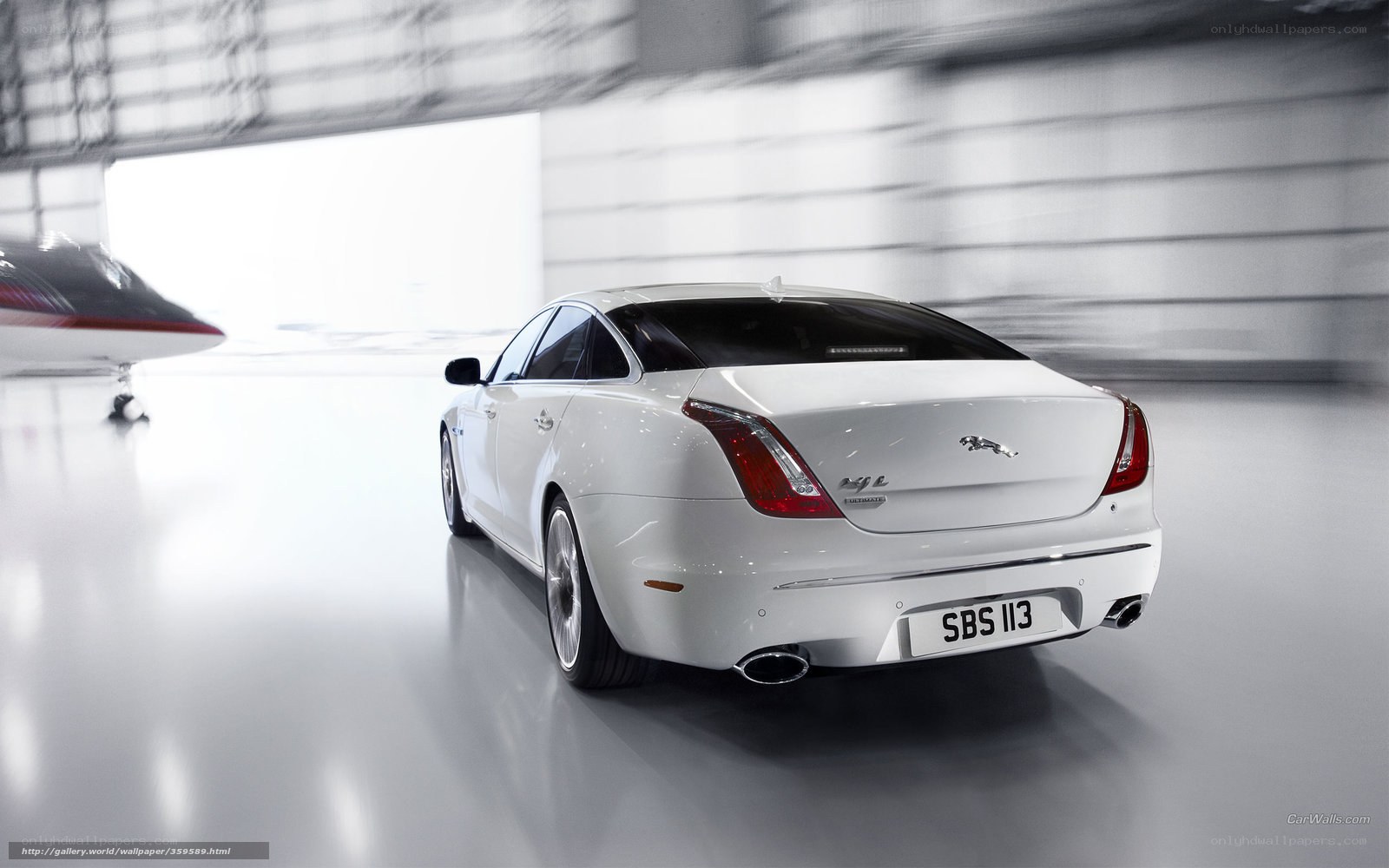 White Jaguar XJL in hangar