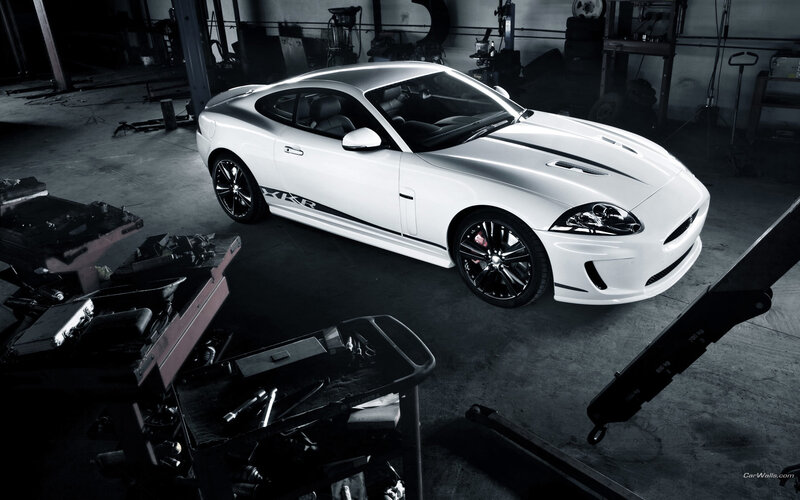 White Jaguar XKR in garage