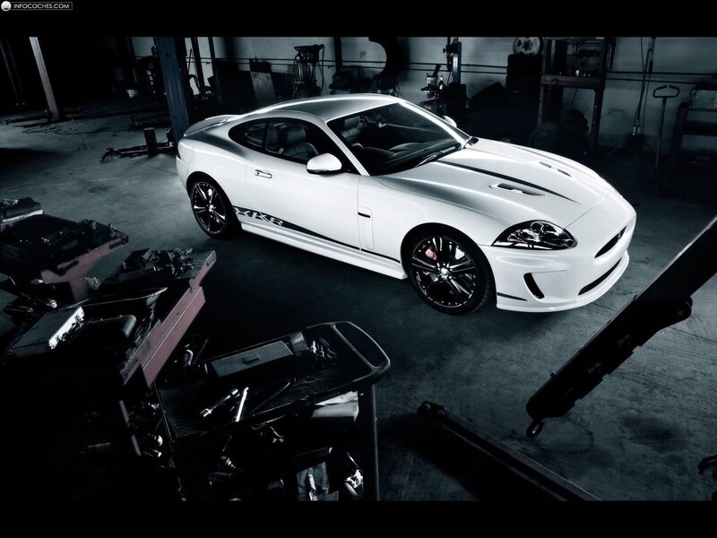 White Jaguar XKR in garage
