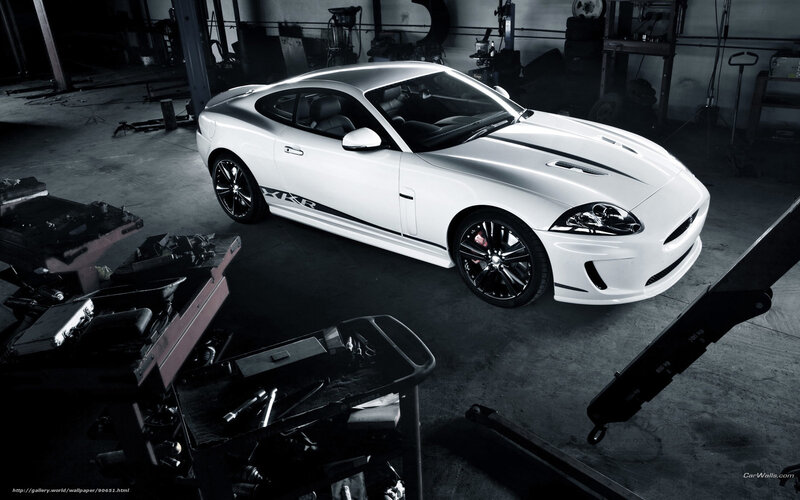 White Jaguar XKR in garage