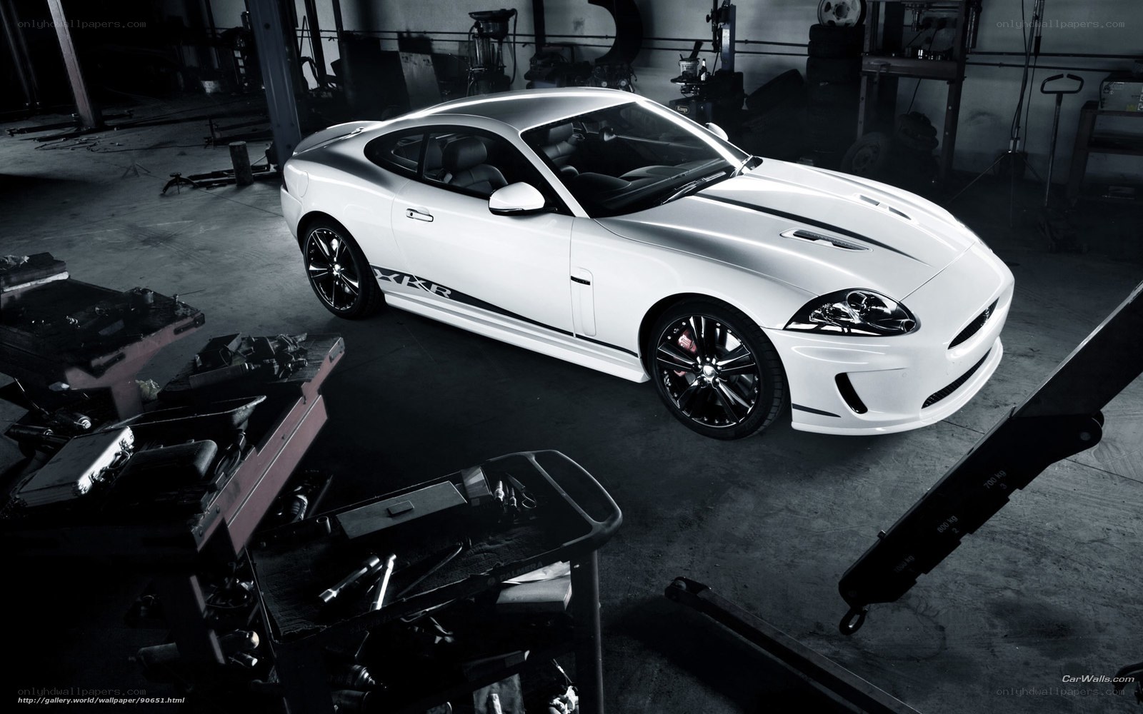 White Jaguar XKR in garage