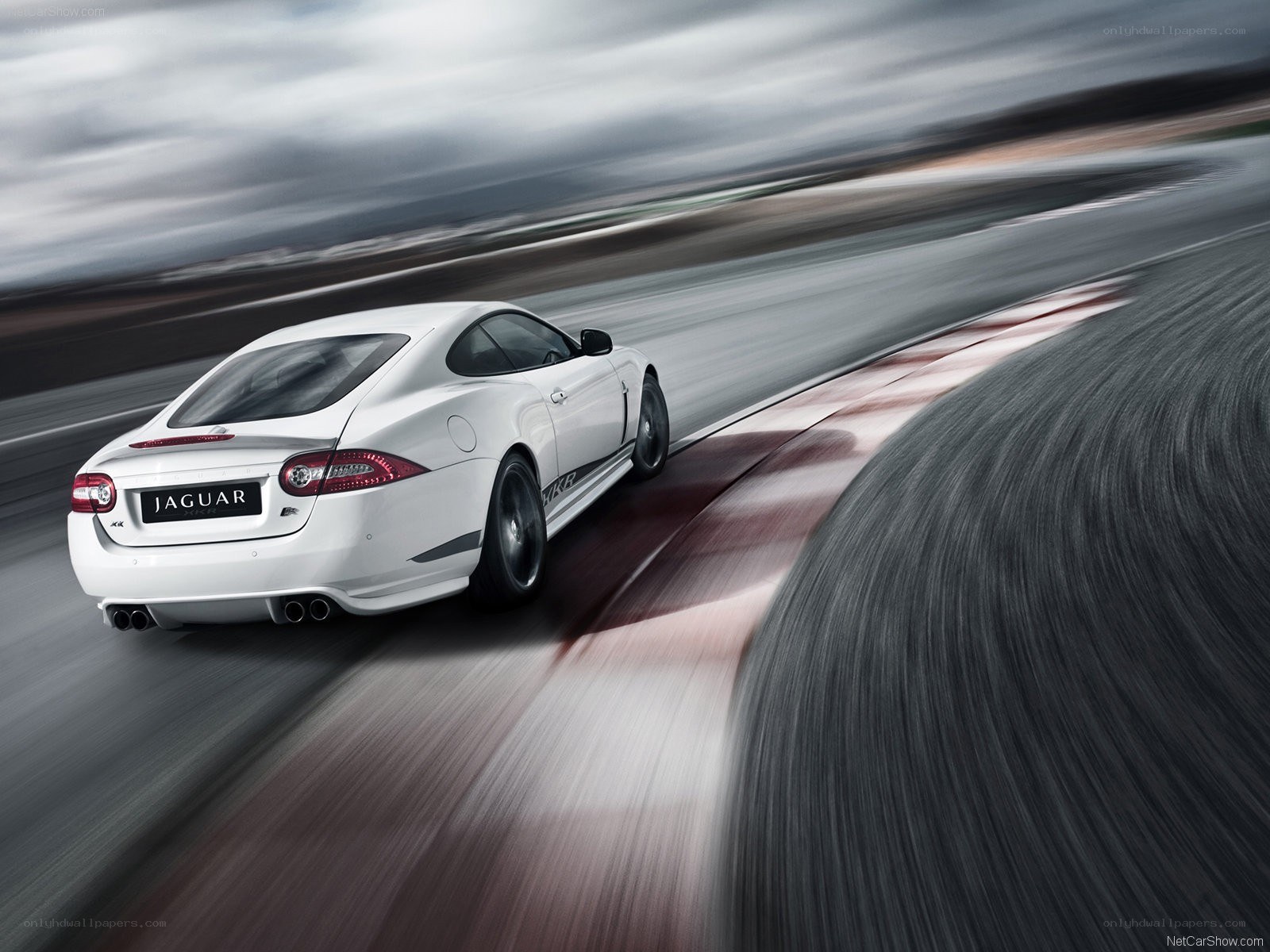 White Jaguar XKR in motion