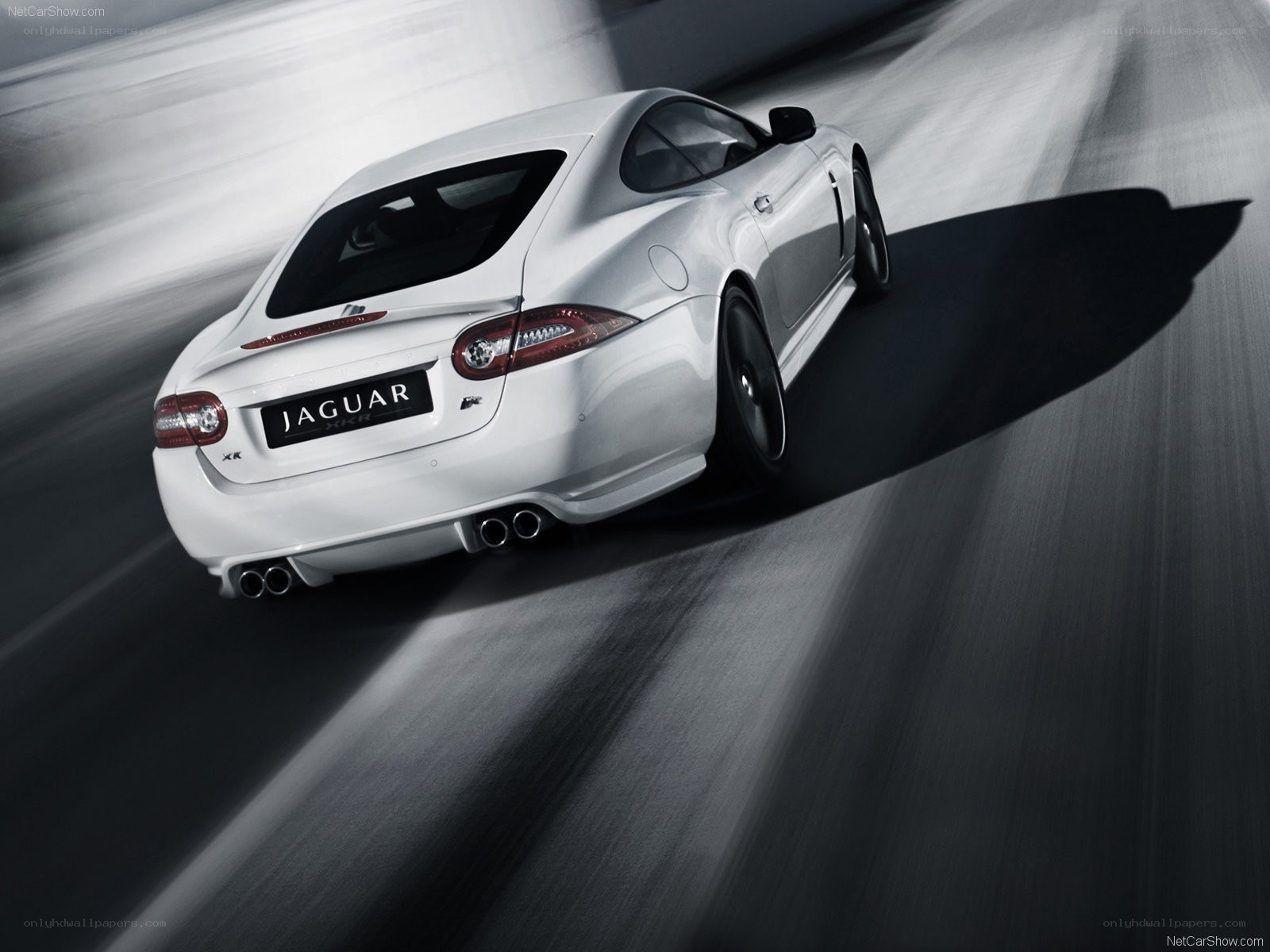 White Jaguar XKR in motion