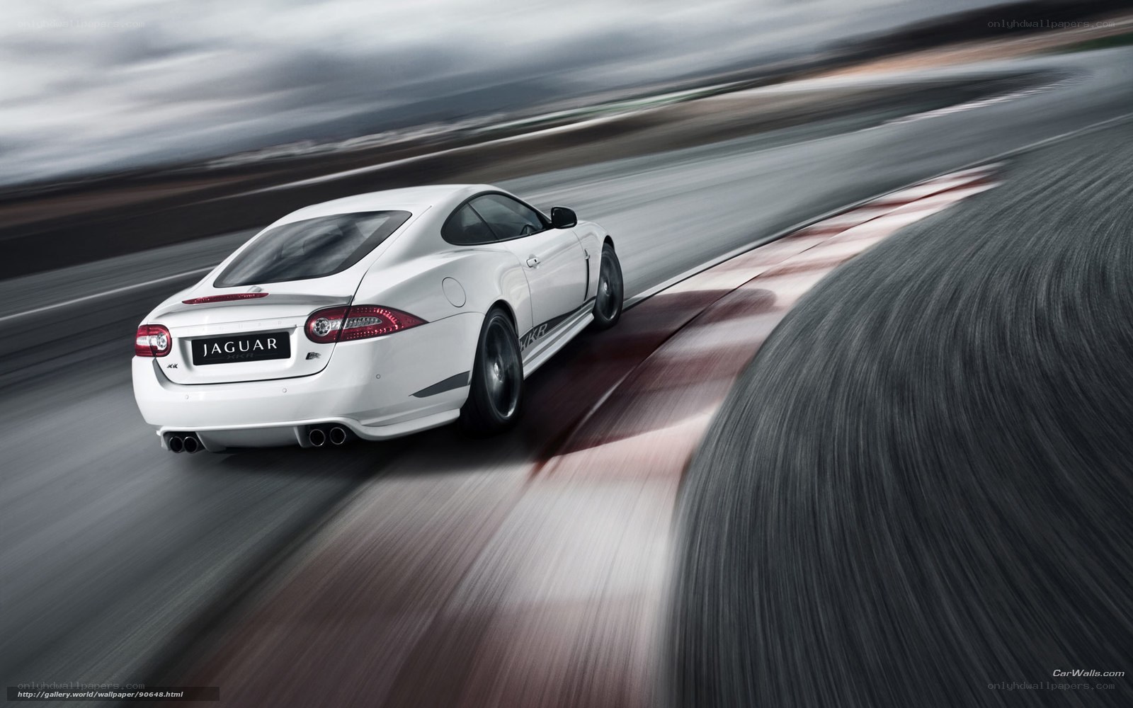 White Jaguar XKR on racetrack
