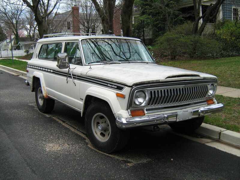White Jeep Cherokee parked on street
