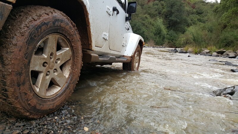 White Jeep in River