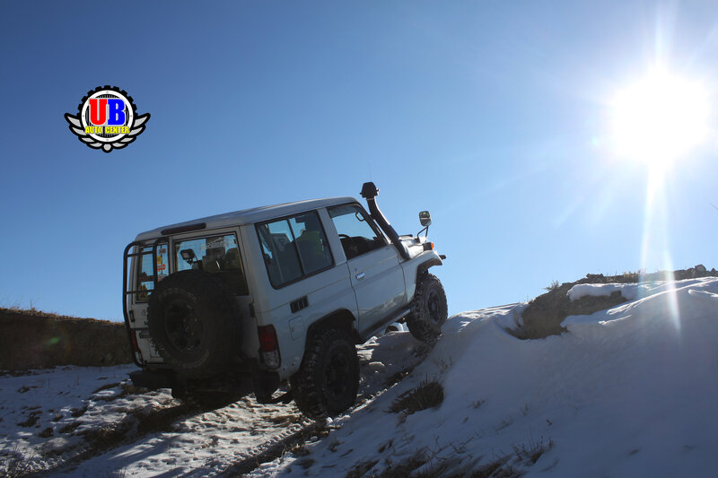 White Jeep on Snowy Hill