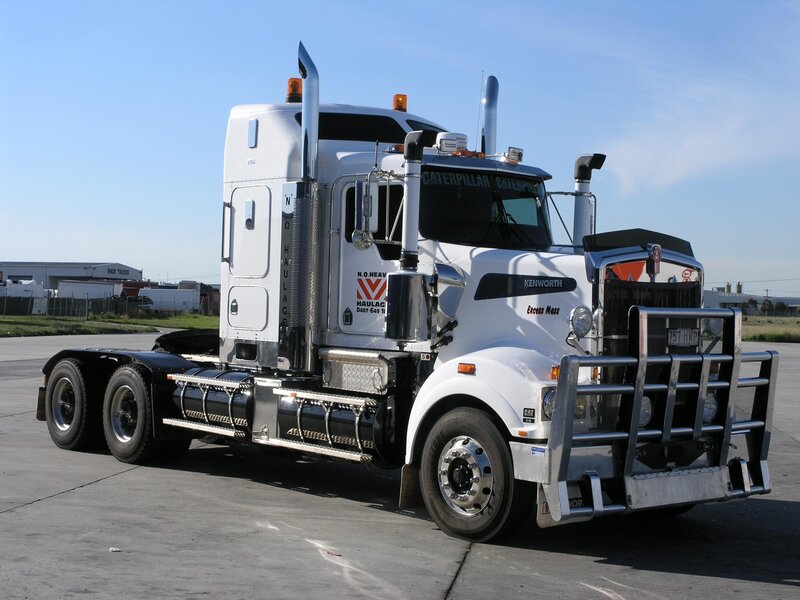 white Kenworth truck on pavement