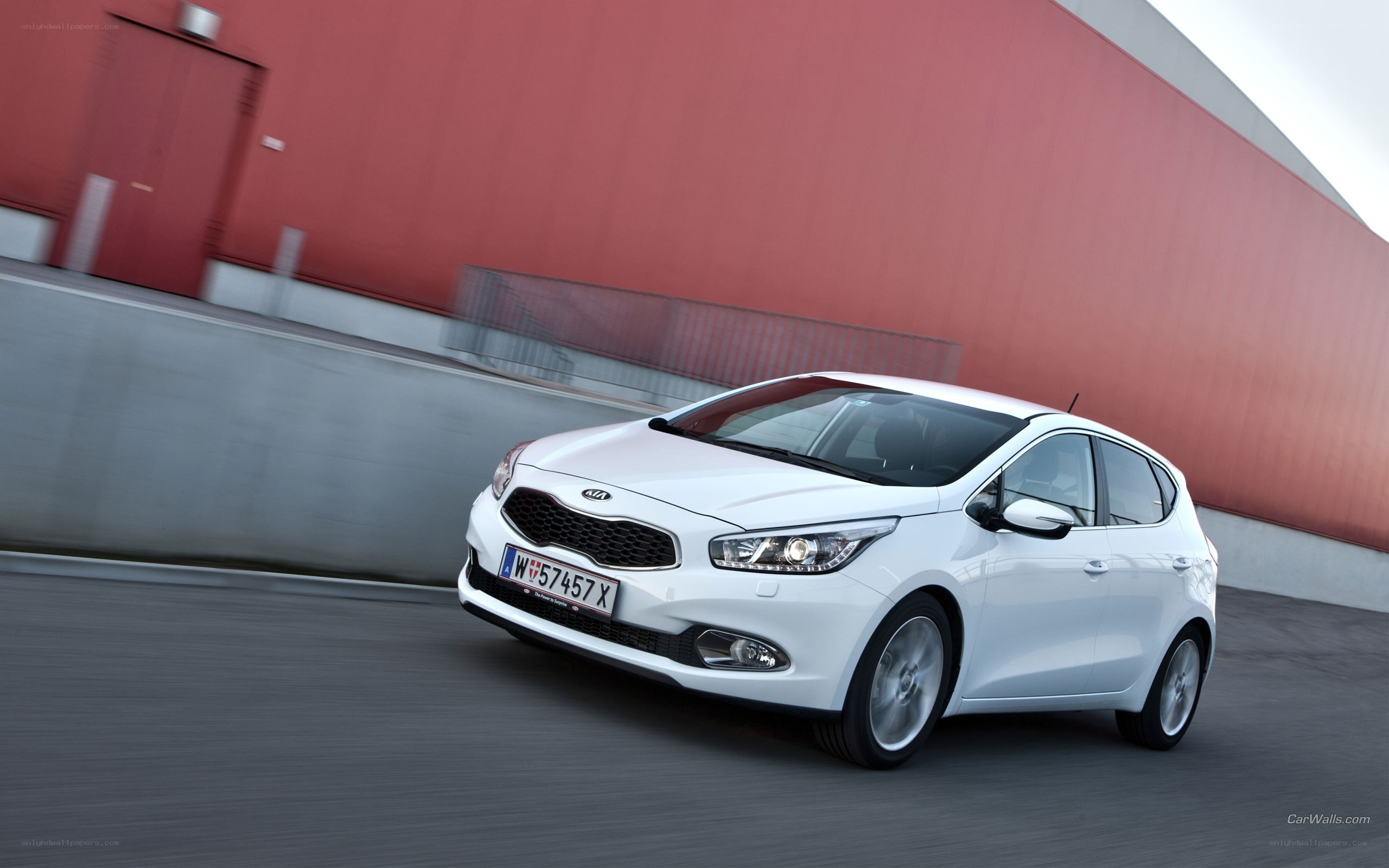 white kia cee'd in motion