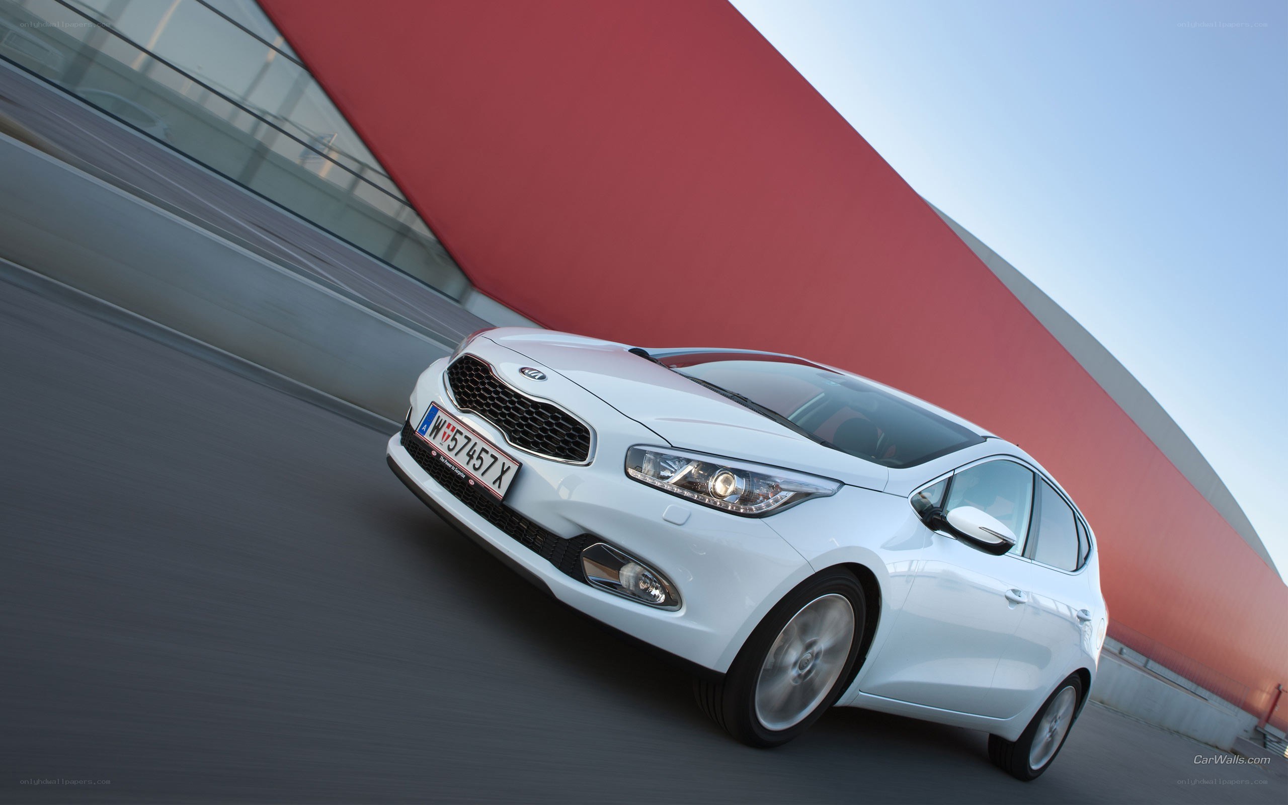 white kia cee'd in motion
