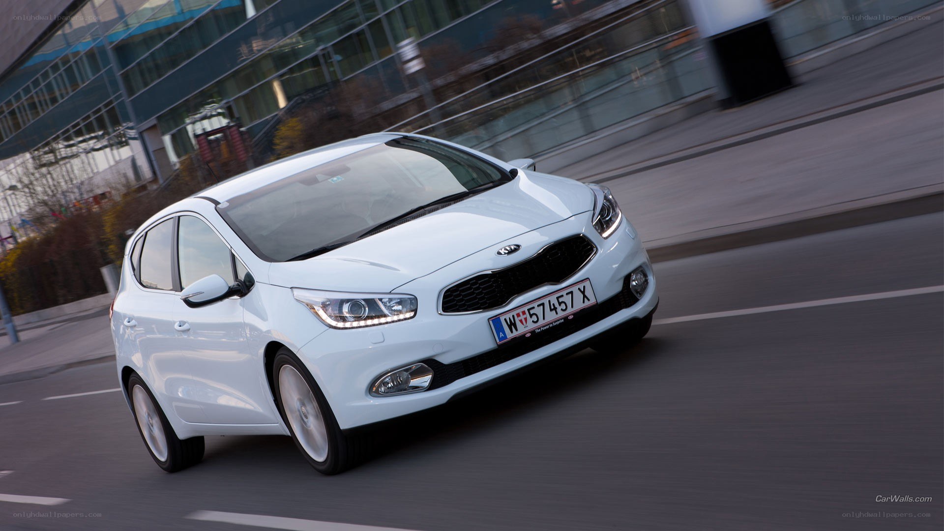 white kia cee'd in motion