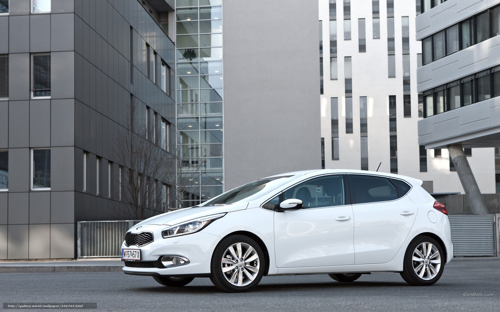 white kia cee'd parked in city