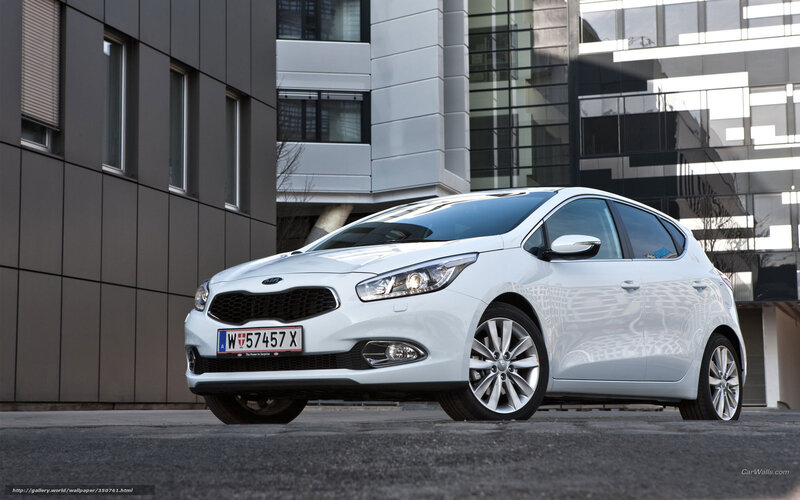 White Kia Cerato parked in city
