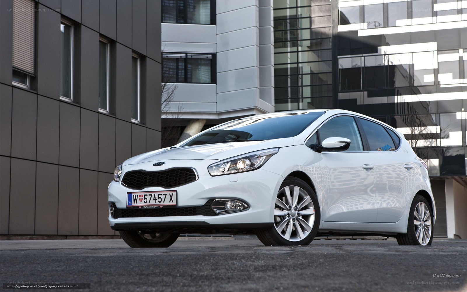 White Kia Cerato parked in city