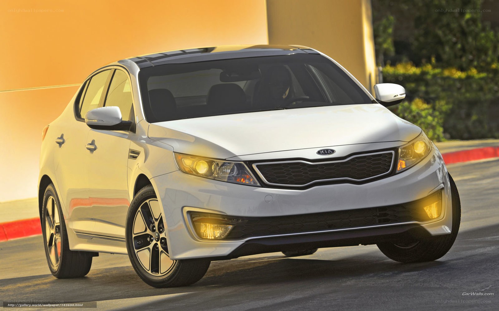 White Kia Optima in motion