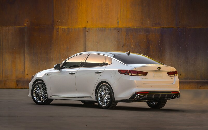 White Kia Sedan — Dramatic