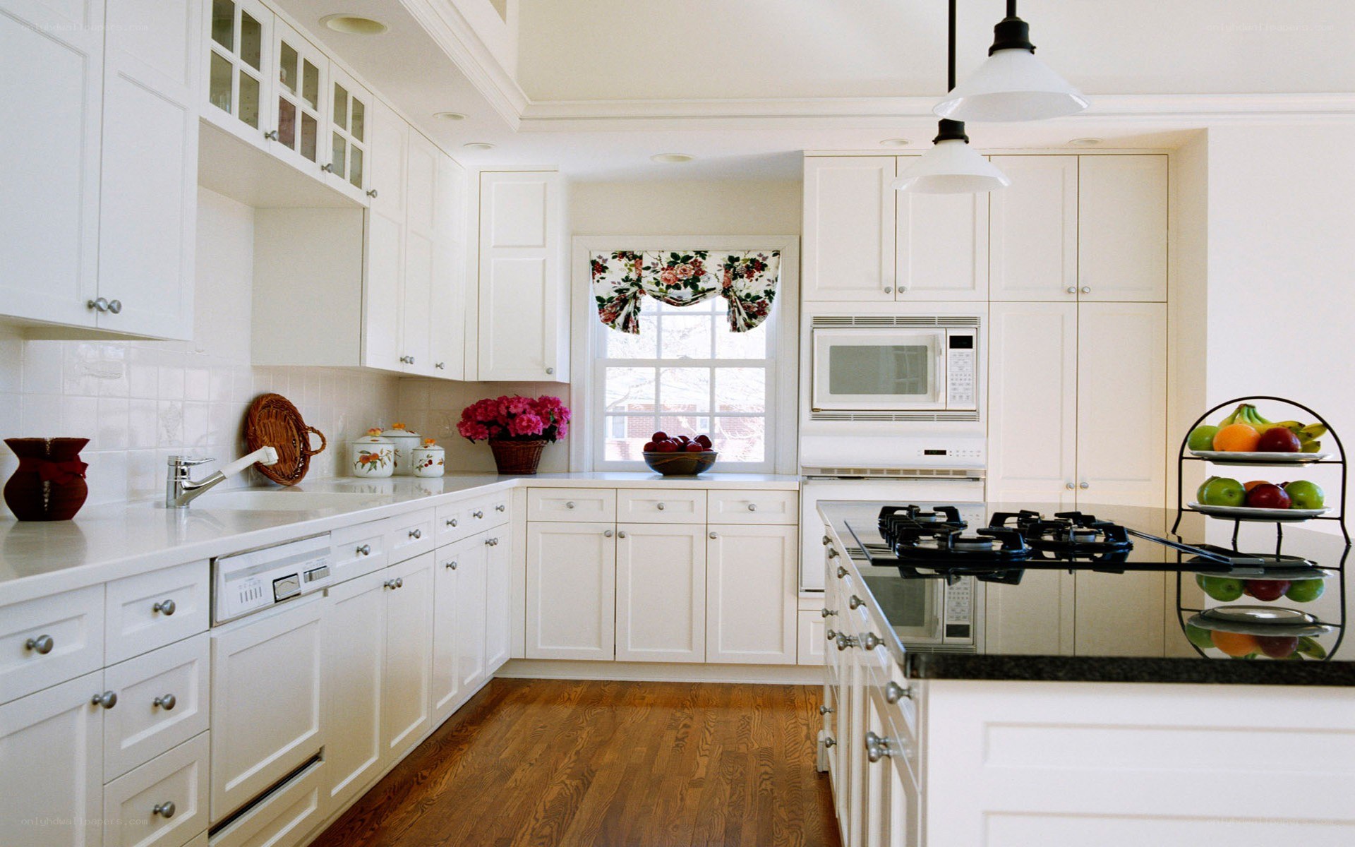 white kitchen with black island