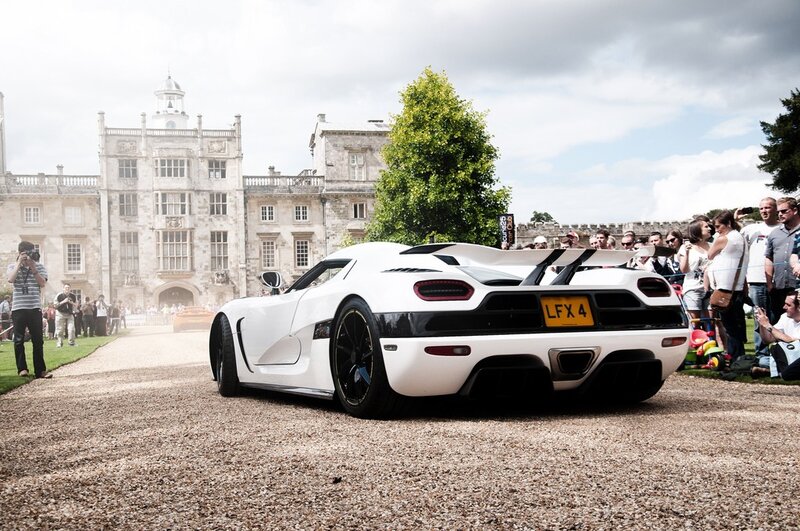 White Koenigsegg at a car show
