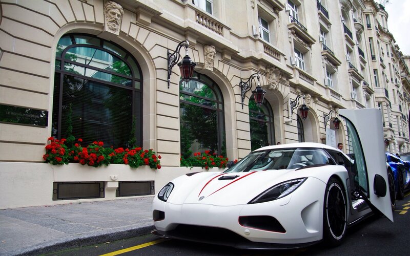 White Koenigsegg on city street