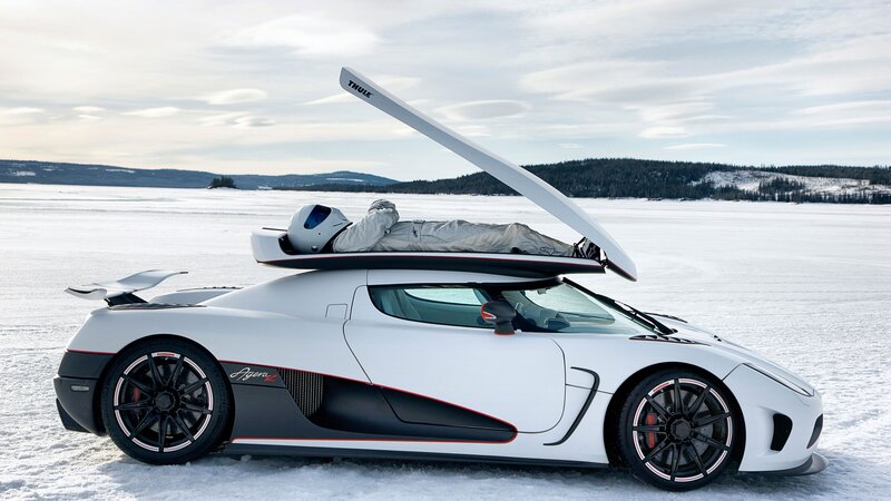 White Koenigsegg on frozen lake