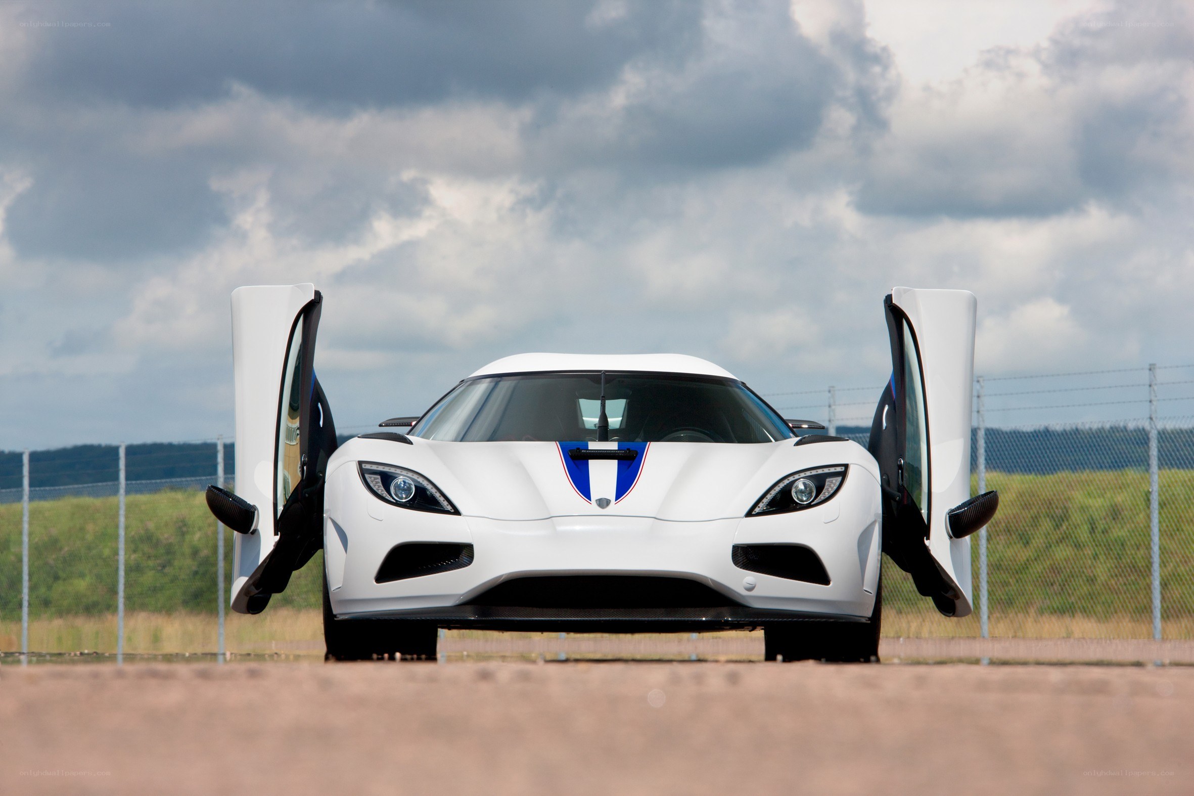 White Koenigsegg with open doors