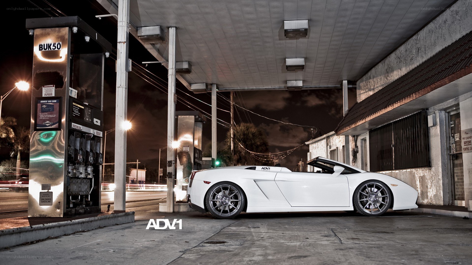 White Lamborghini at gas station