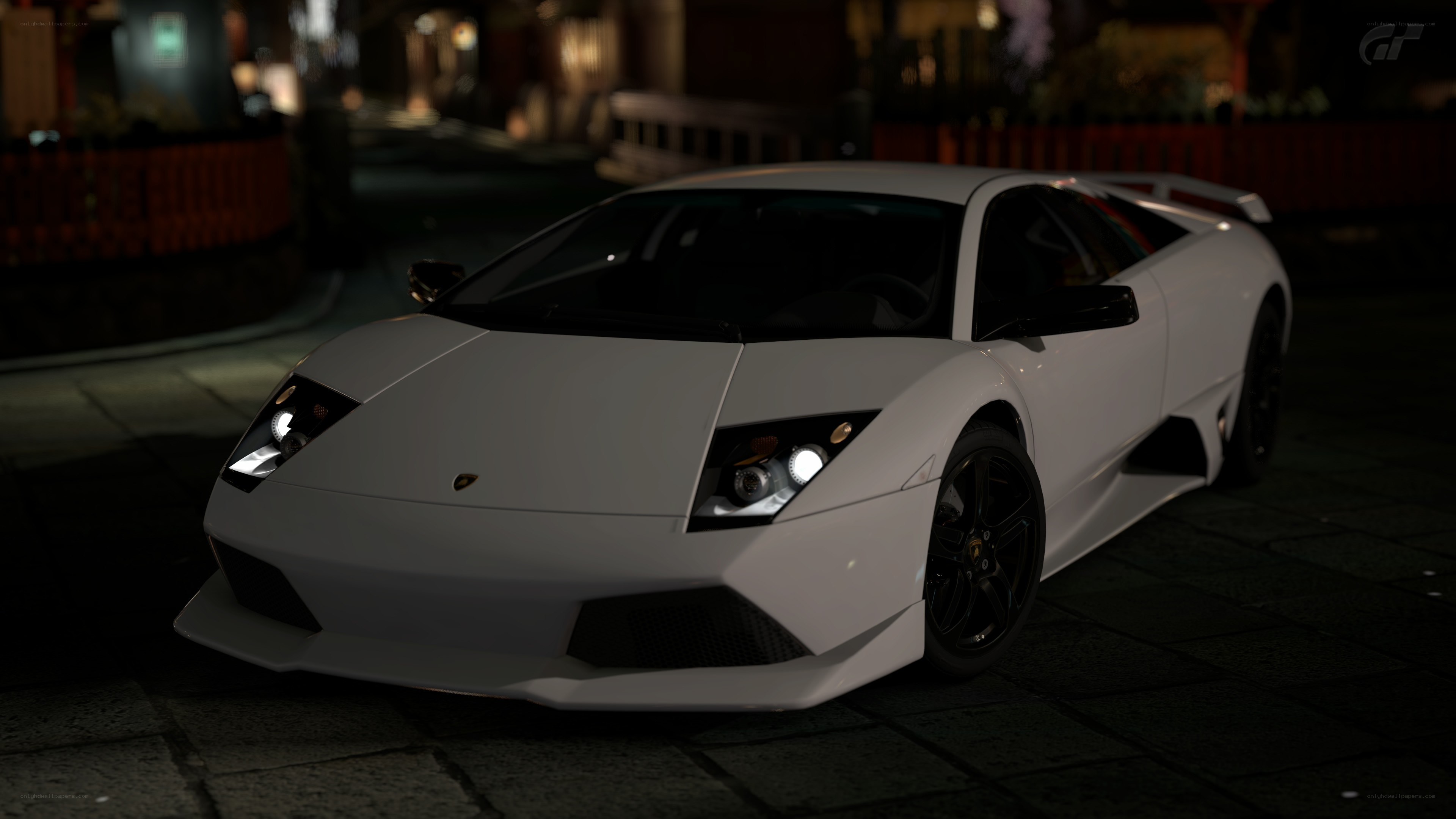 white lamborghini at night