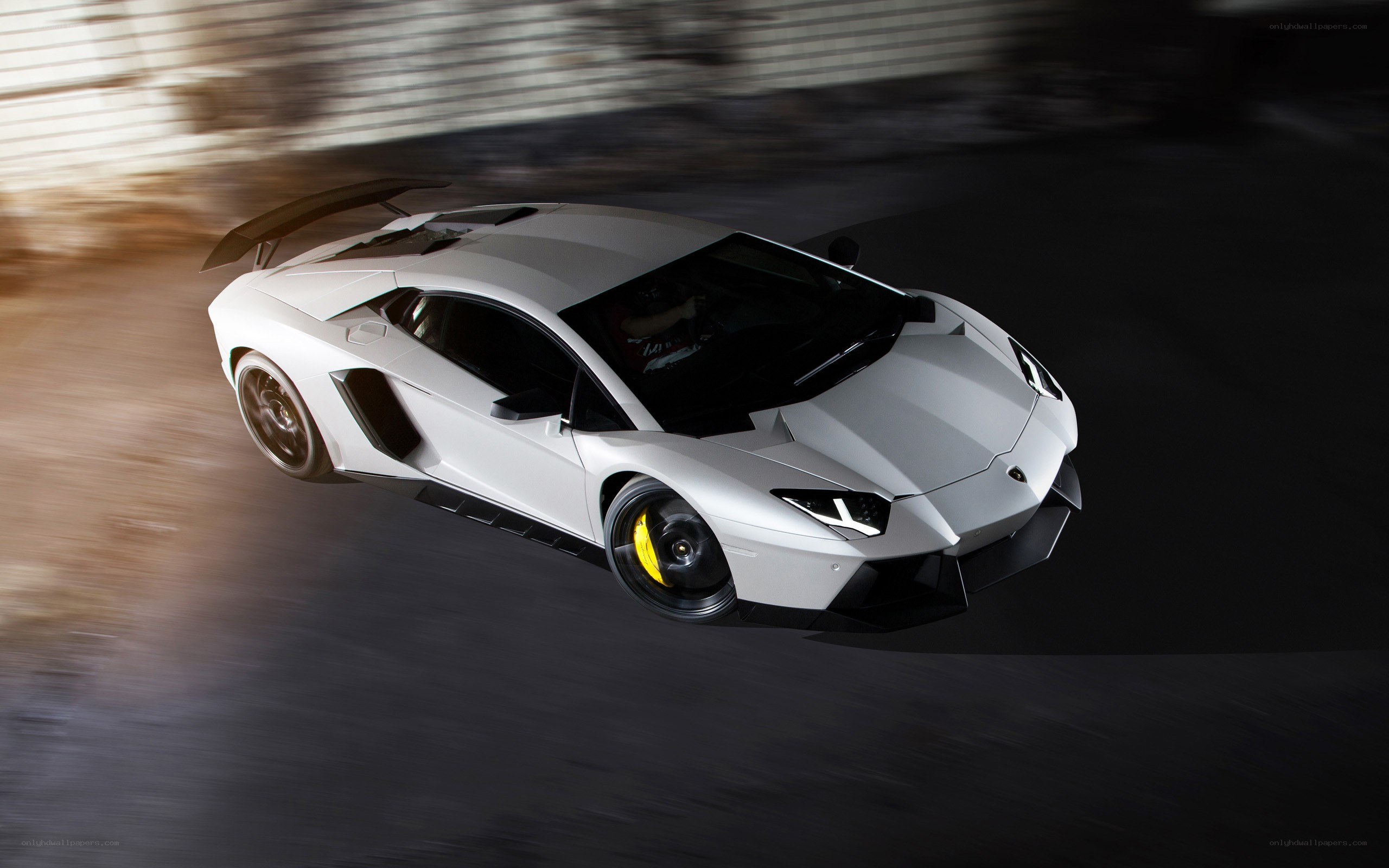 White Lamborghini Aventador in motion