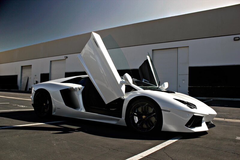 White Lamborghini Aventador with doors open