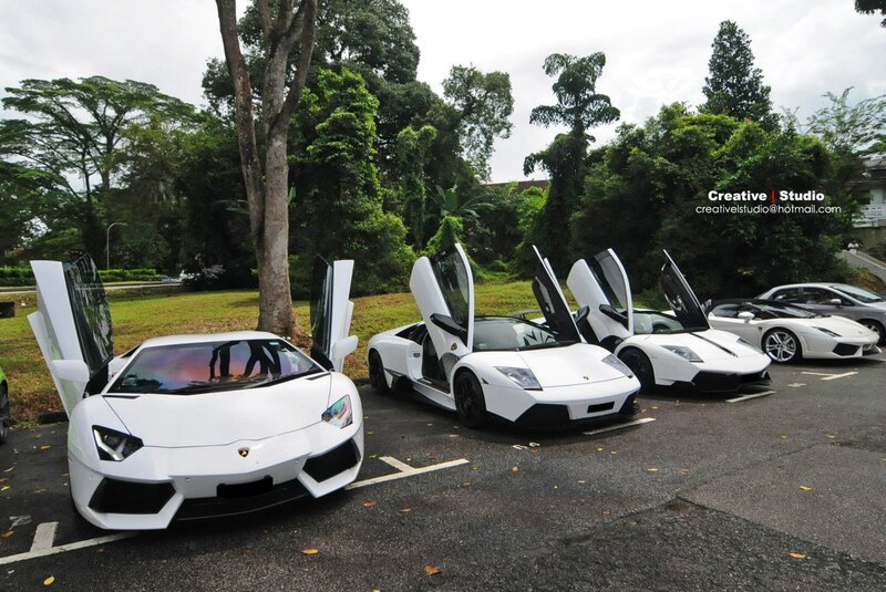 White Lamborghini cars in parking lot