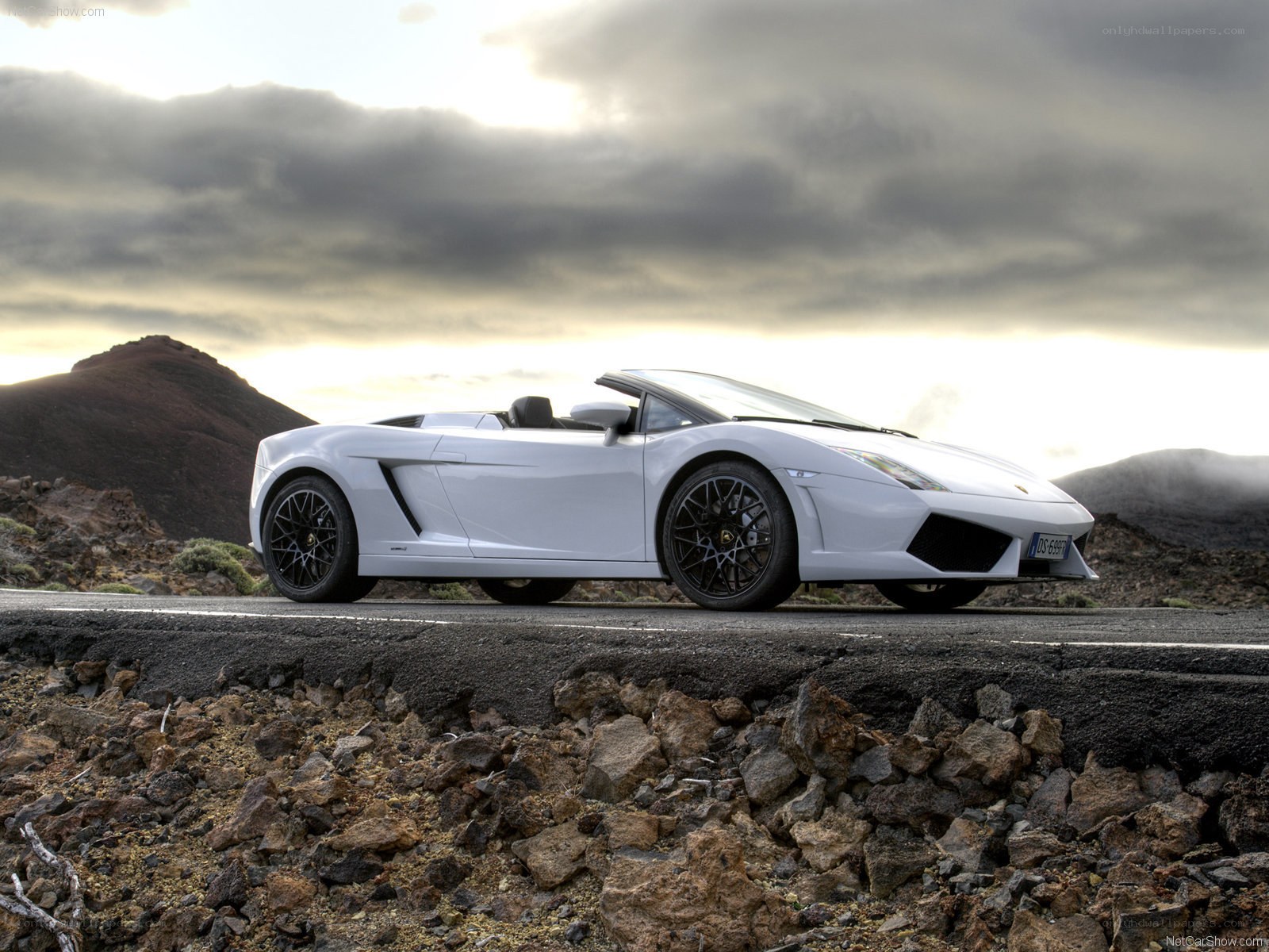 white lamborghini convertible on road