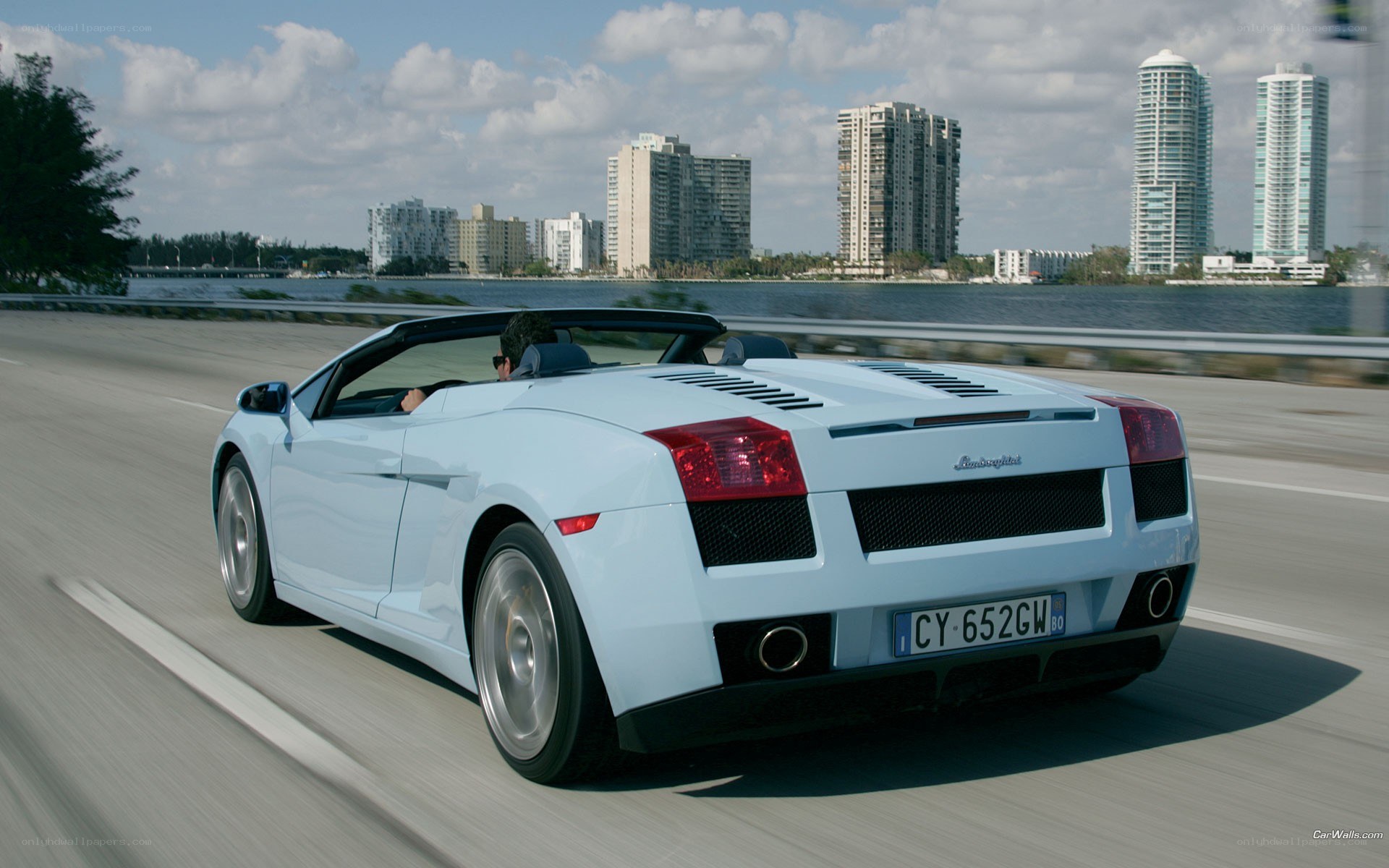 White Lamborghini convertible on road
